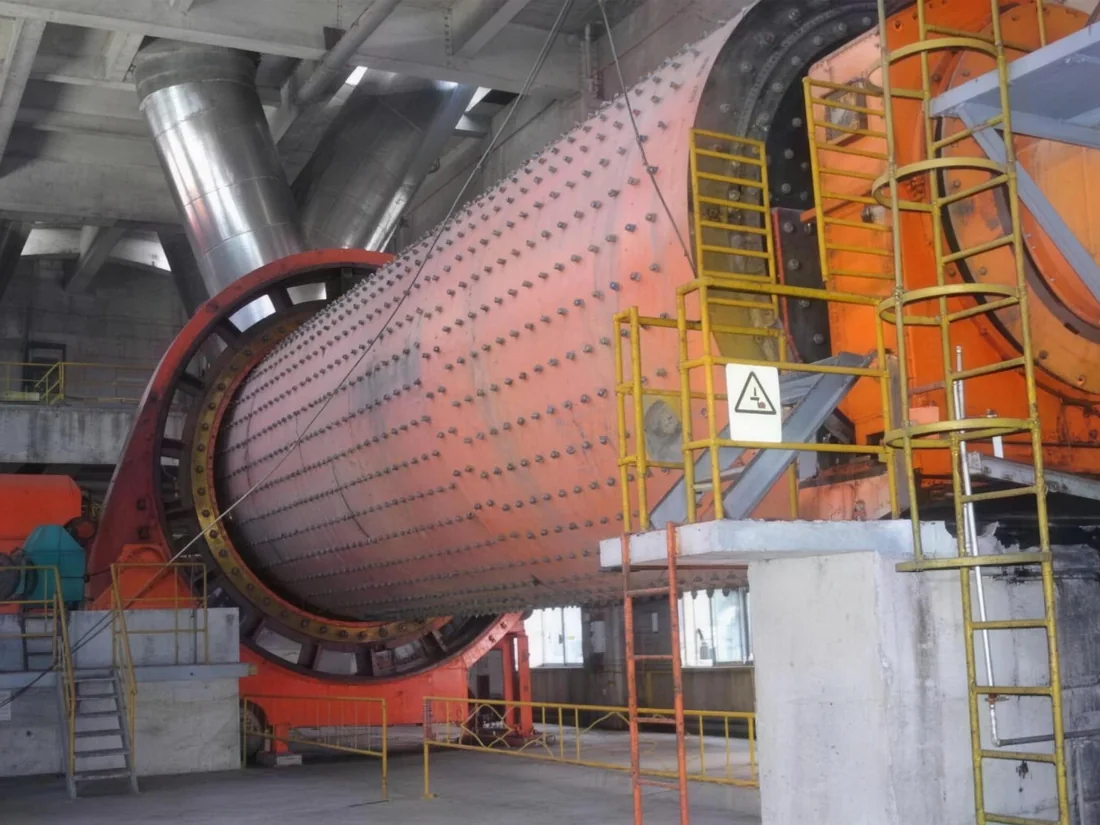 Rotary kiln shell turning on its support rollers in a processing plant