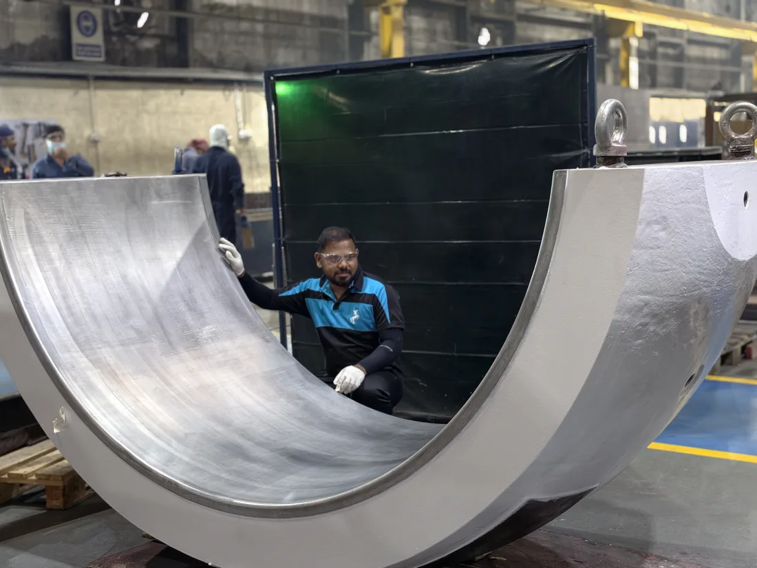 Large white metal lined trunnion bearing shell manufactured by Shaheen Arabia, Jubail