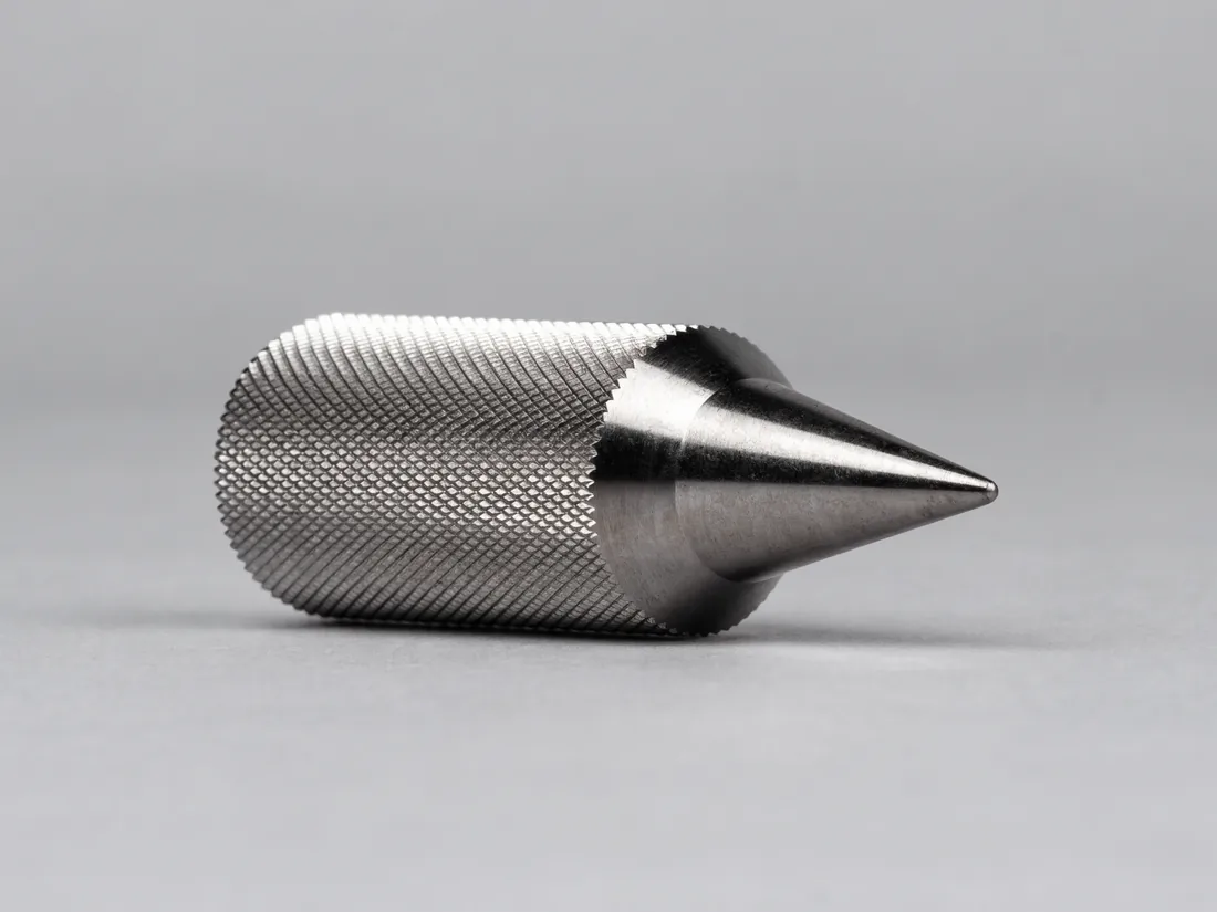 Hardened steel punch with a knurled body