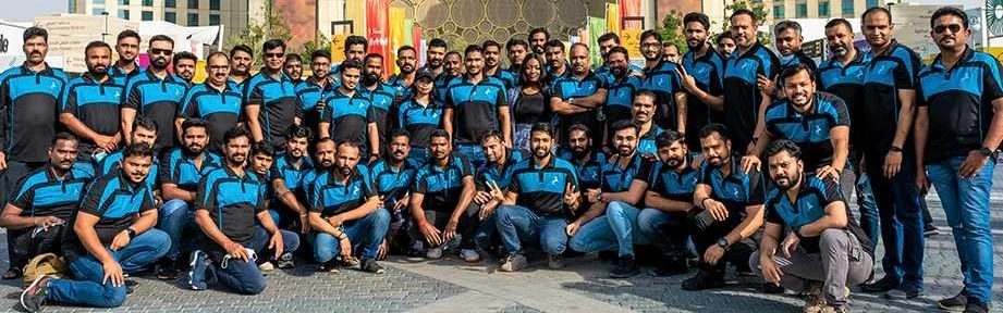 The Falcon Group team photographed together at a group event