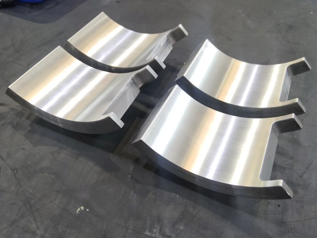 CNC-machined bearing shell halves with milled flanges, Shaheen Arabia, Jubail